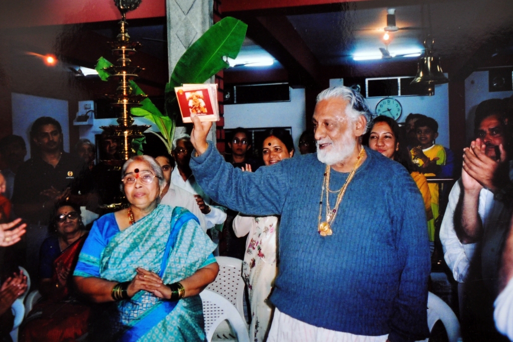 Swami Ji and Amma releasing the devotional album